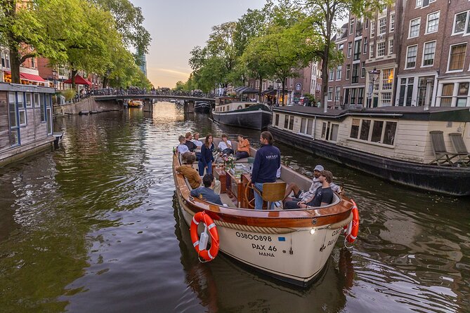 Amsterdam 2 Hour Small-Group Canal Cruise with Dutch Snacks & Bar - The Amstel River and Magere Brug