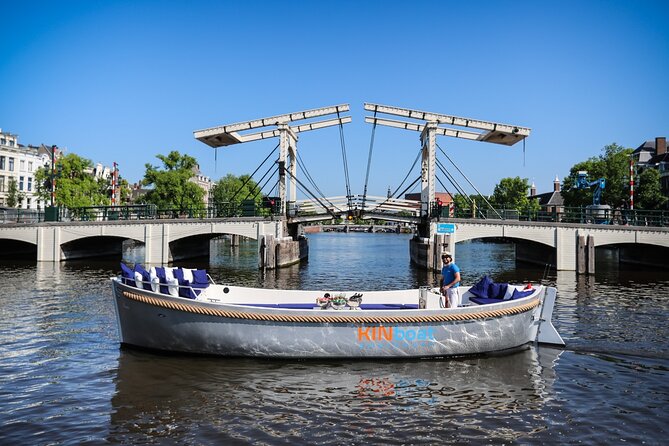 Amsterdam Canal Cruise in Open Boat with Unlimited Drinks Option - Sunset, bridge lights, and evening timing