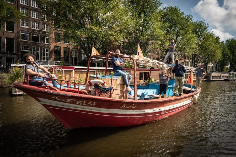 Amsterdam: Canal Cruise on a Wooden Refugee Boat - Hearing the guide’s personal journey