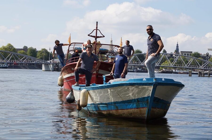 Amsterdam: Canal Cruise on a Wooden Refugee Boat - Questions are part of the experience
