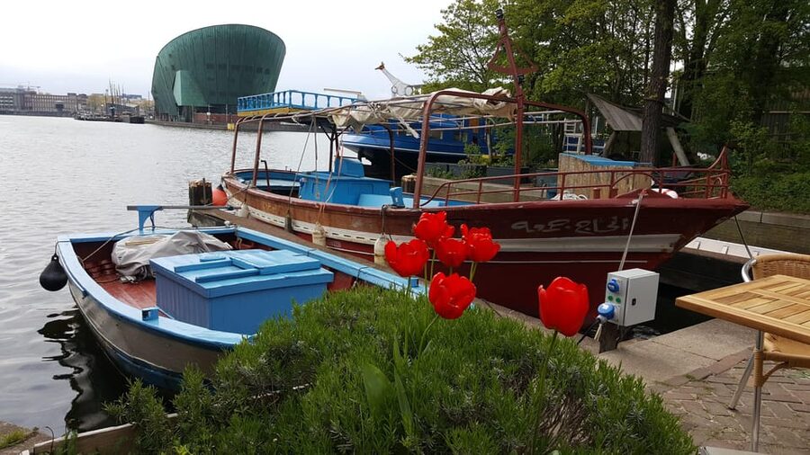 Amsterdam: Canal Cruise on a Wooden Refugee Boat - Practical comfort, timing, and weather
