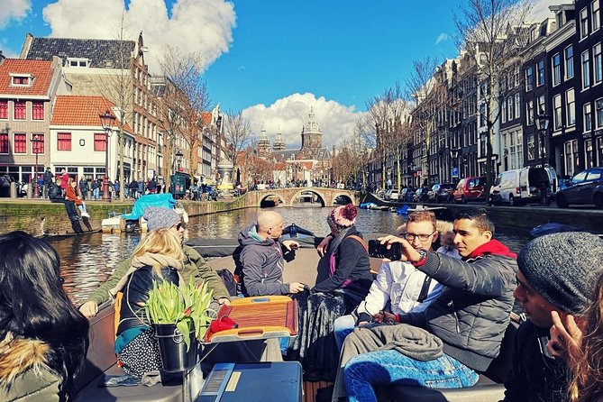 Amsterdam Canal Tour by Open Boat – 90 min Small Group Experience - Old locks, warehouses, and De Waag