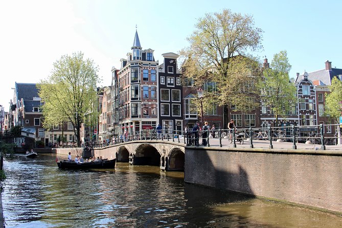 Amsterdam Canal Tour by Open Boat – 90 min Small Group Experience - Quiet canals and the old defense tower