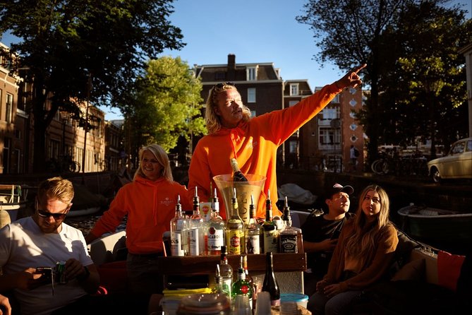 Amsterdam Evening Canal Cruise with Live Guide and Onboard Bar - The Amstel, Royal Theatre Carré, and Magere Brug