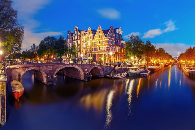 Amsterdam Evening Canal Cruise with Live Guide and Onboard Bar - The Opera House, Flower Market, and Mint Tower
