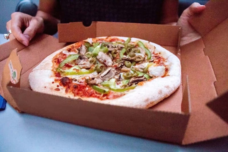 Amsterdam: Evening Pizza Cruise Along the Canals - Getting settled on the heated boat