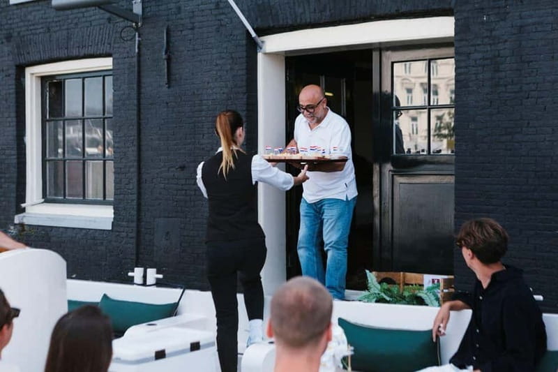 Amsterdam Evening (Sunset) Canal Cruise w/ optional drinks - Boarding a small electric Eco Boat