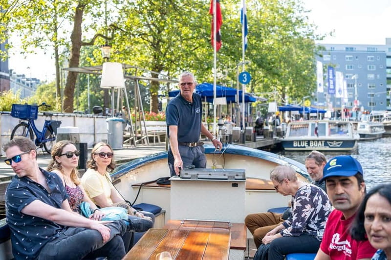 Amsterdam: Guided City Highlights Open Boat Canal Cruise - Why a small open boat changes the Amsterdam canal ride