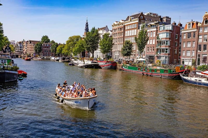 Amsterdam: Guided City Highlights Open Boat Canal Cruise - Through Amsterdam-Centrum and toward Westerkerk