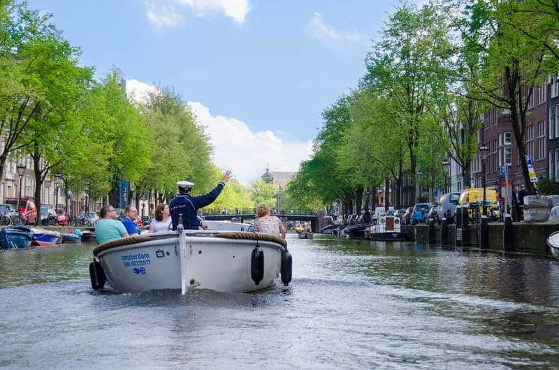 Amsterdam: Guided City Highlights Open Boat Canal Cruise - Starting at Stadhouderskade 501 near Leidseplein