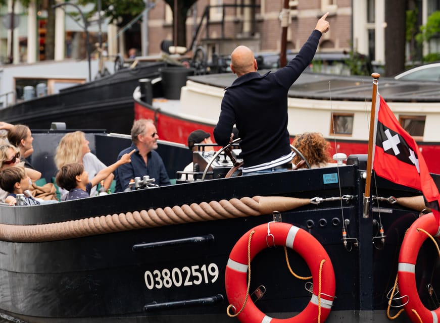 Amsterdam: Guided Open Boat Canal Cruise Including Drink - The Amstel, Blauwbrug, and Skinny Bridge