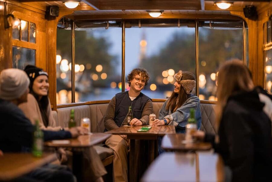 Amsterdam: Heated Canal Cruise with Unlimited Drinks & Bite - The guide is a major part of the experience