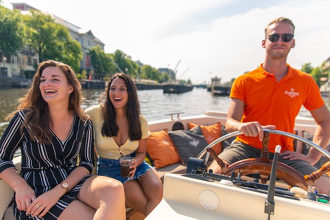 Amsterdam Luxury Canal Cruise + Unlimited Drinks & Bites option - Bloemenmarkt, Munttoren, and the Bridge of 15 Bridges