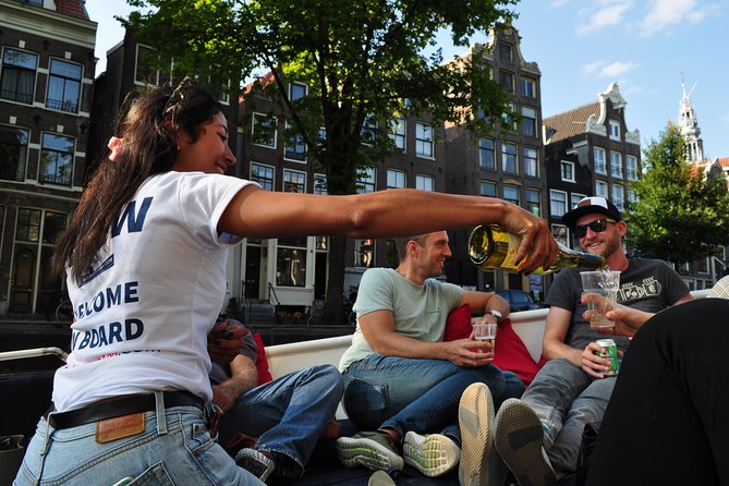 Amsterdam Open Boat Cruise with Live Guide and Two Drinks - Museums, markets, and the eastern waterways