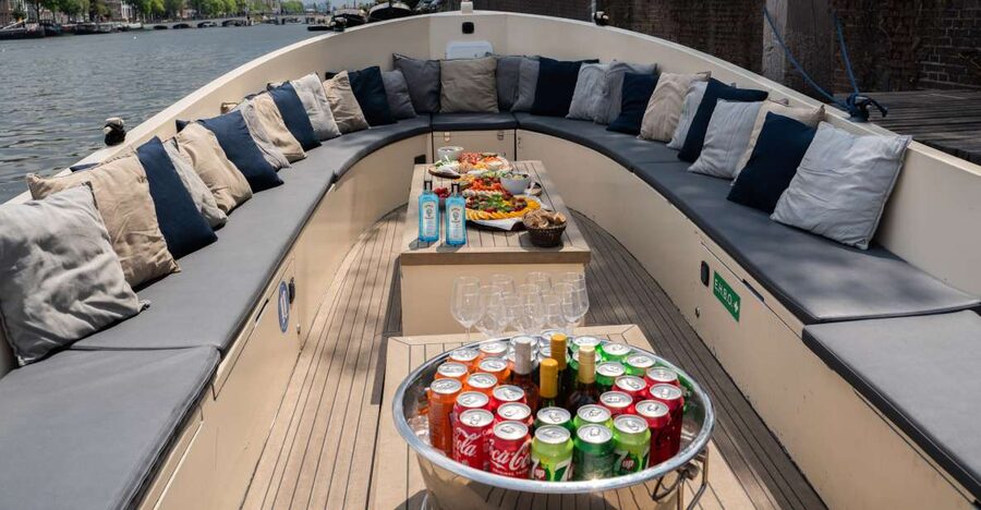 Amsterdam: Private Canal Booze Cruise with Unlimited Drinks - NEMO Science Museum and the eastern canals