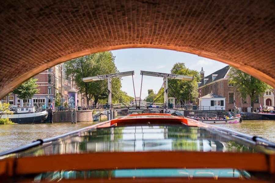 Amsterdam: Rijksmuseum Entry Ticket and Canal Cruise Combo - The audio guide and onboard atmosphere