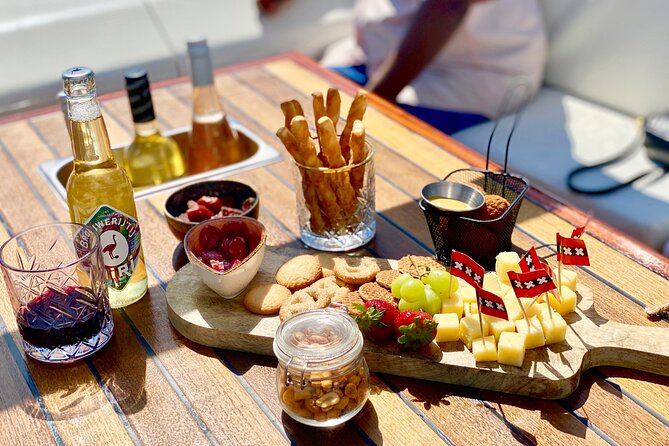 Amsterdam Small-Group Canal Cruise Including Snacks and Drinks - What the captain adds to the ride
