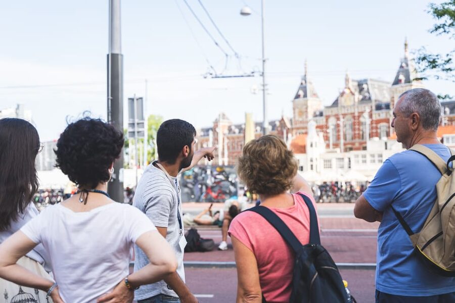 Amsterdam Small-Group Walking Tour with Canal Cruise - Beursplein, Dam Square, and Amsterdam’s public heart