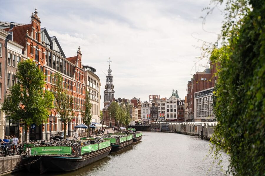 Amsterdam Small-Group Walking Tour with Canal Cruise - Zeedijk and Nieuwmarkt: old streets with contrasting stories