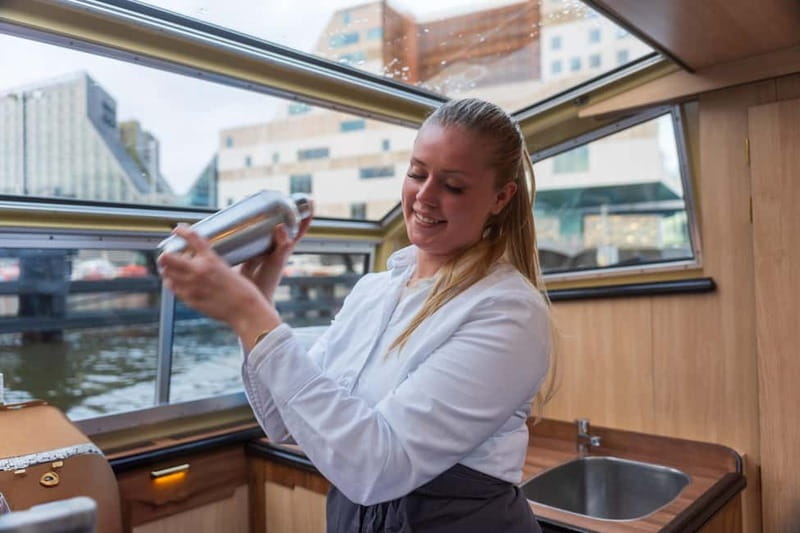 Amsterdam: Unlimited Cocktails Cruise on the Canals - Amsterdam canals with a cocktail in hand