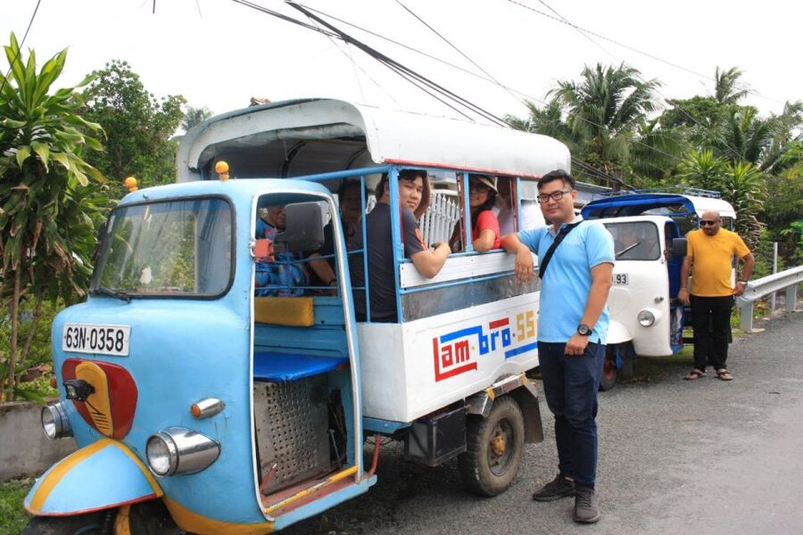 Authentic Mekong Delta: Tuk Tuk, Rowing Boat, Biking Tour - Rowing through water coconut canals