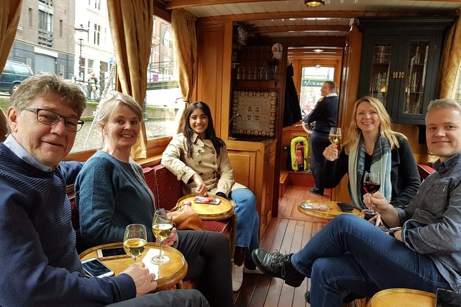 Eating Amsterdam: Food Tour & Canals Cruise - Narrow alleys and the city’s harder past