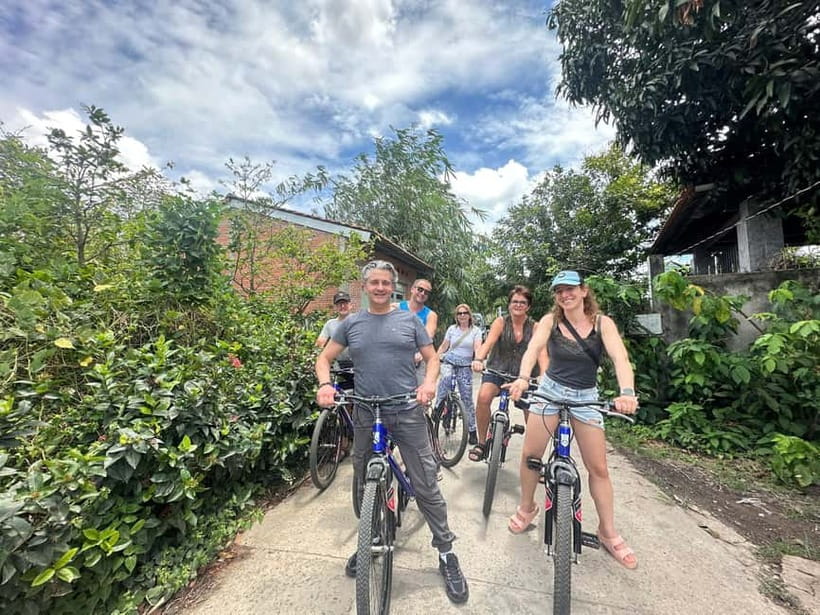 From Ho Chi Minh: Cai Be Boat & Bike Mekong Delta Experience - Fruit orchards, folk music, and warm honey tea