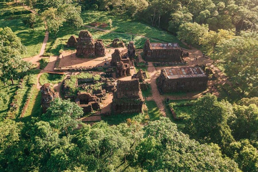 From Hoi An: Discover My Son Sanctuary & Sunset River Cruise - Walking through the Champa ruins