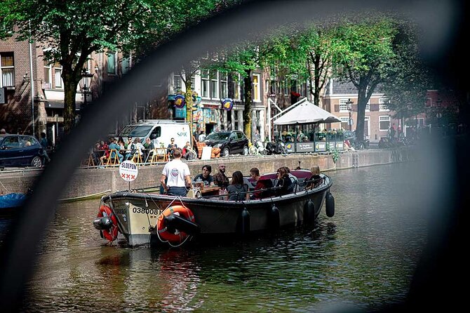 Guided Amsterdam Canal Cruise – Snacks & Drinks on board(1 Hour) - Jewish Quarter, remembrance, and community