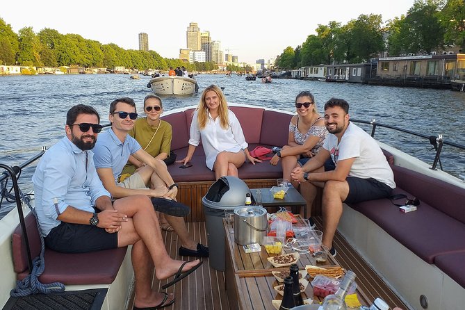 Guided Amsterdam Canal Cruise – Snacks & Drinks on board(1 Hour) - Starting near the oldest Amsterdam
