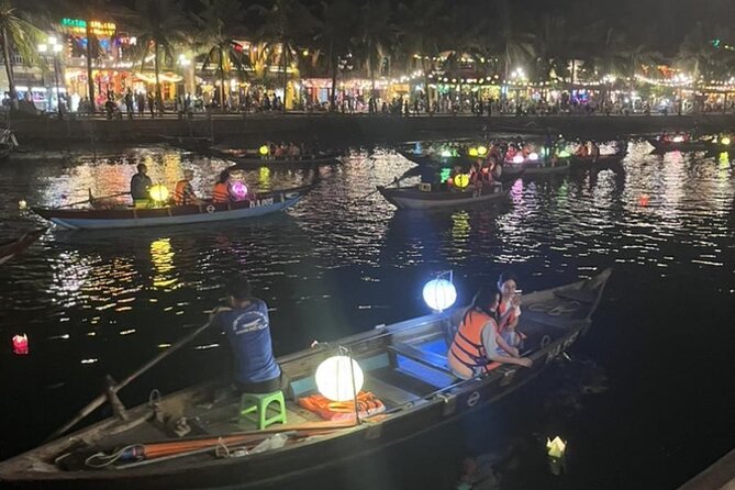 Hoai River Boat Trip by Night with Release Lantern - Releasing the flower lantern