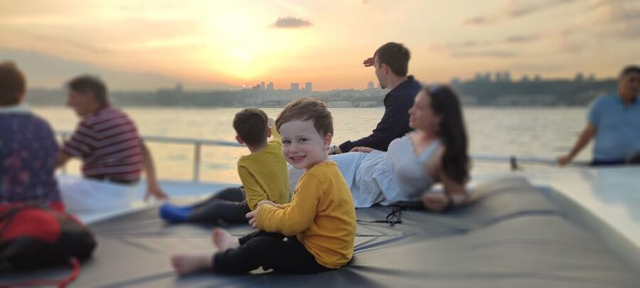 Istanbul: Bosphorus Sunset Cruise on Yacht with Live Guide - Under the bridge toward Arnavutköy and Bebek