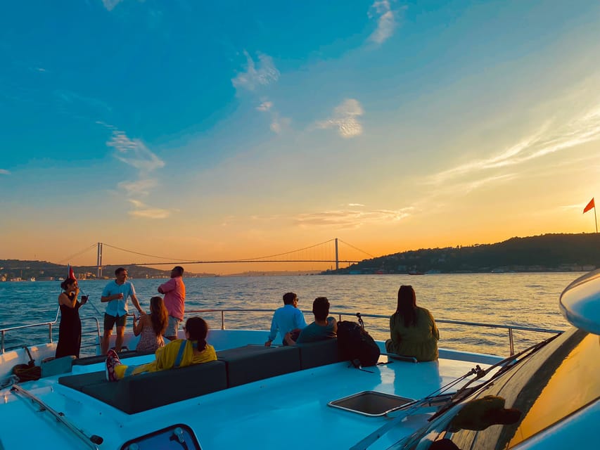 Istanbul: Bosphorus Sunset Yacht Cruise with Live Guide - Passing under the bridges toward Rumeli Fortress