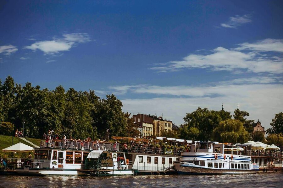 Krakow: Sightseeing Cruise by Vistula River - Open deck, seating, and onboard comfort