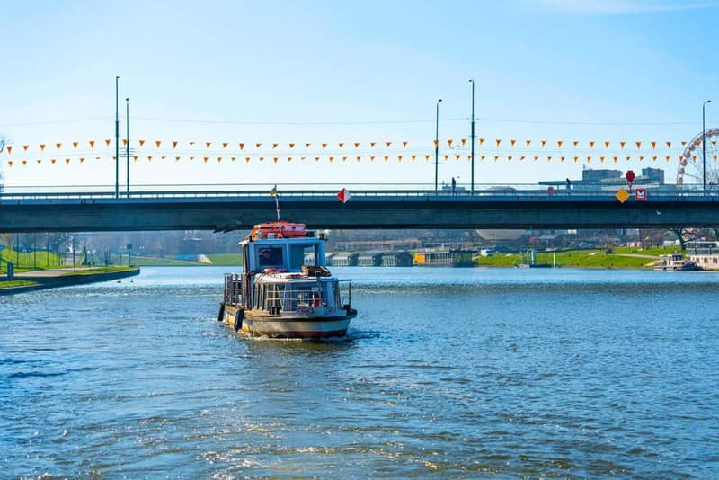 Krakow: Vistula River Sightseeing Cruise with Audio Guide - The boat, seating, and weather