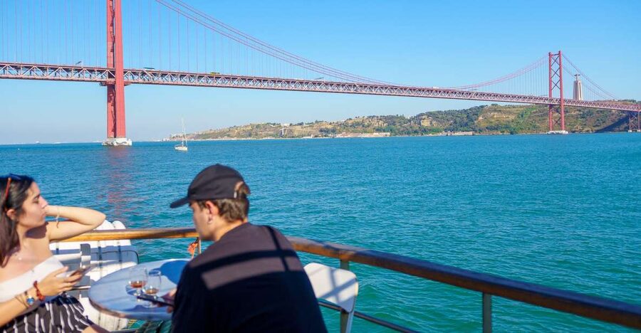 Lisbon: Tagus River Cruise with Welcome Drink - The boat, seating, and sundeck