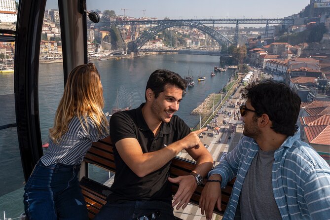 Porto Walking Tour, Lello Bookshop, River Cruise and Cable Car - The Douro cruise beneath Porto’s bridges