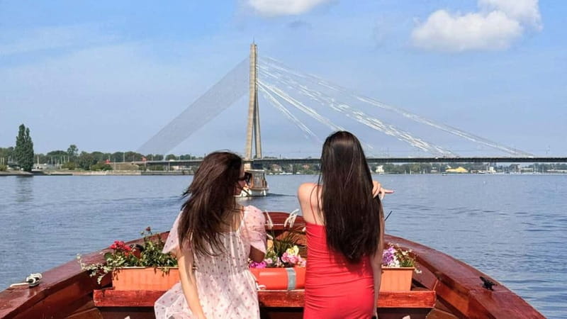 Riga: Canal Boat Tour with Welcome Drink & Audio Guide - Onto the Daugava beneath Riga’s bridges